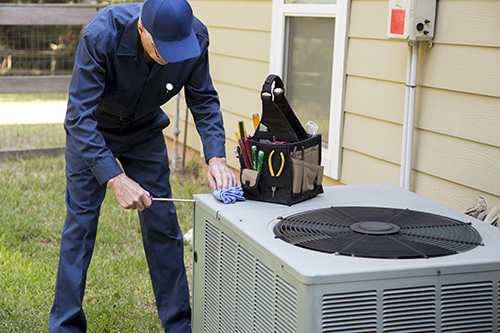 Technician services outside AC units and generator